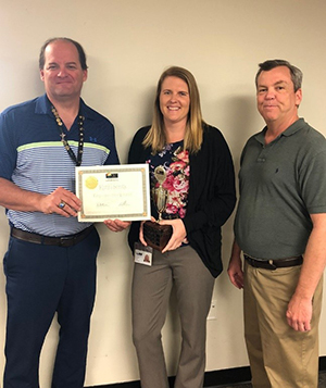 Employee of the Second Quarter 2019, Kathi Sentz, with Tax Collector Ken Burton and Director Tony Conboy